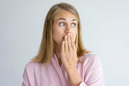 A woman with bad breath at D.A. Dental in Auburn, MA