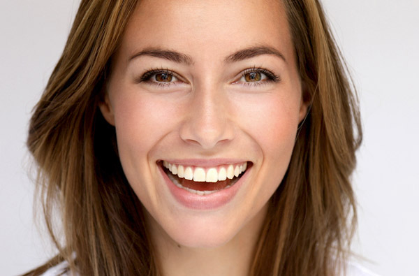 Beautiful woman smiling after cosmetic dentistry at D.A Dental in Auburn, MA