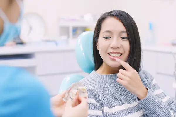 Doctor explaining the dental implant process to a patient at D.A. Dental in Auburn, MA